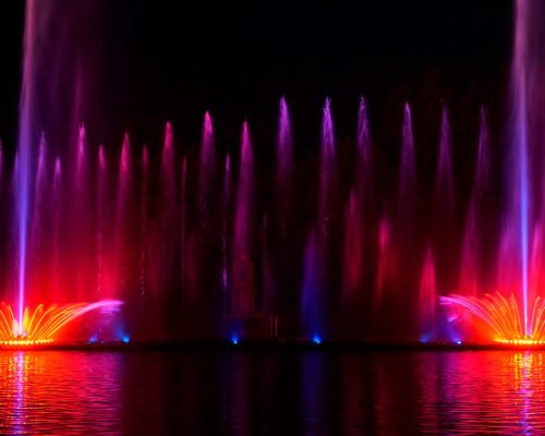 Selective,Focus.,Night,Laser,Fountain,Show,,On,The,Roshen,Embankment,